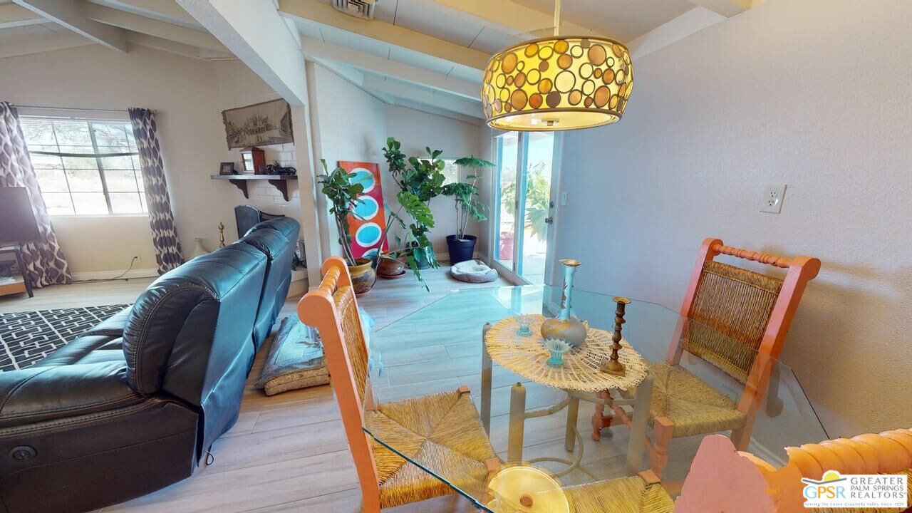 14701 Old Morongo Road Whitewater, CA 92282 - Photo 7 of 70 a living room with furniture and a chandelier