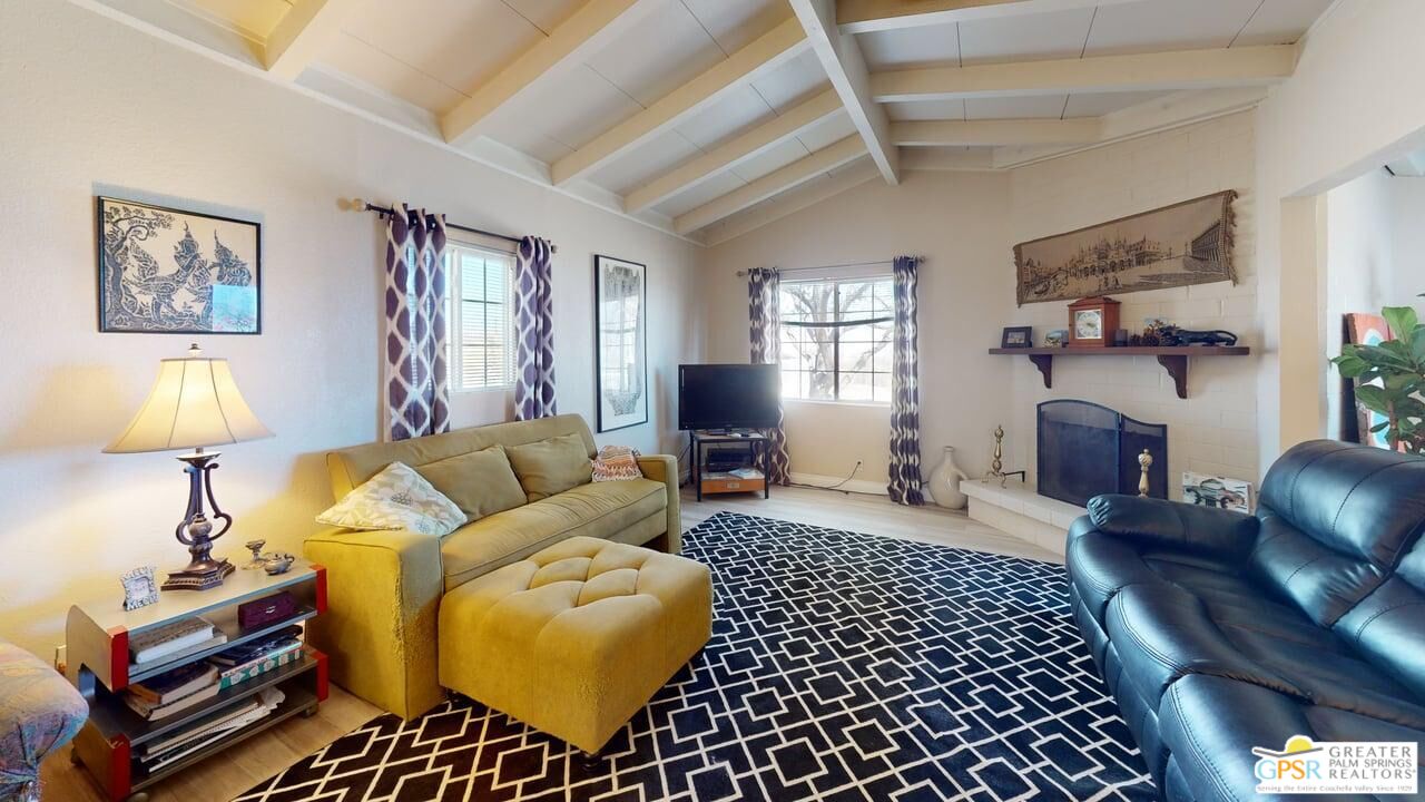 14701 Old Morongo Road Whitewater, CA 92282 - Photo 10 of 70 a living room with furniture a lamp and a window