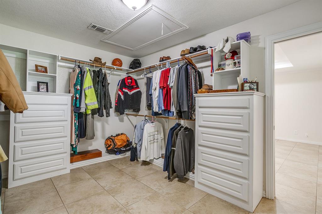 2196 Old Agnes Road Weatherford, TX 76088 - Photo 21 of 35 Huge Walk in Primary Closet with custom closet system and built ins