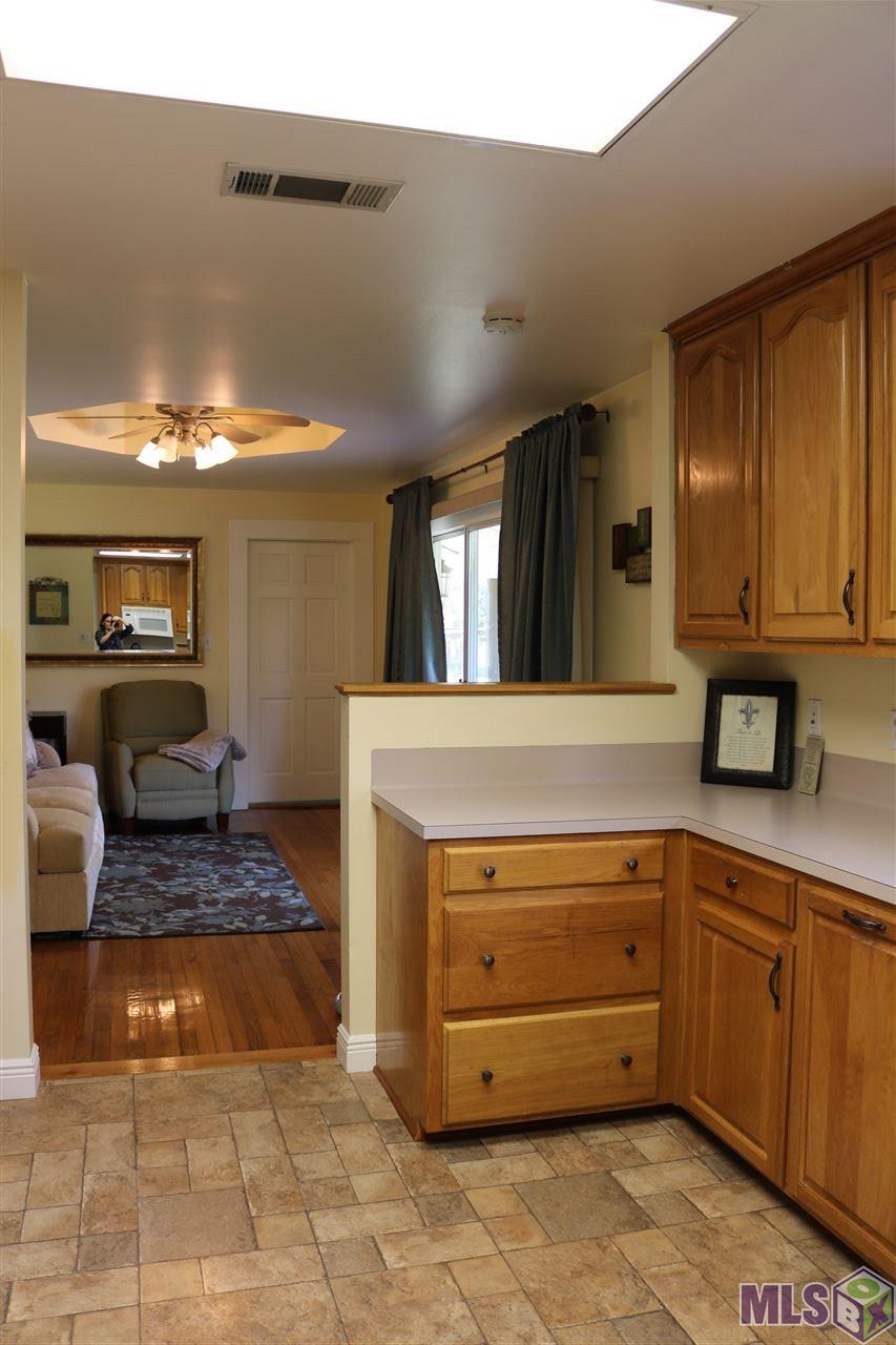 8901 Arnold Road Denham Springs, LA 70726 - Photo 6 of 23 Kitchen View to Den