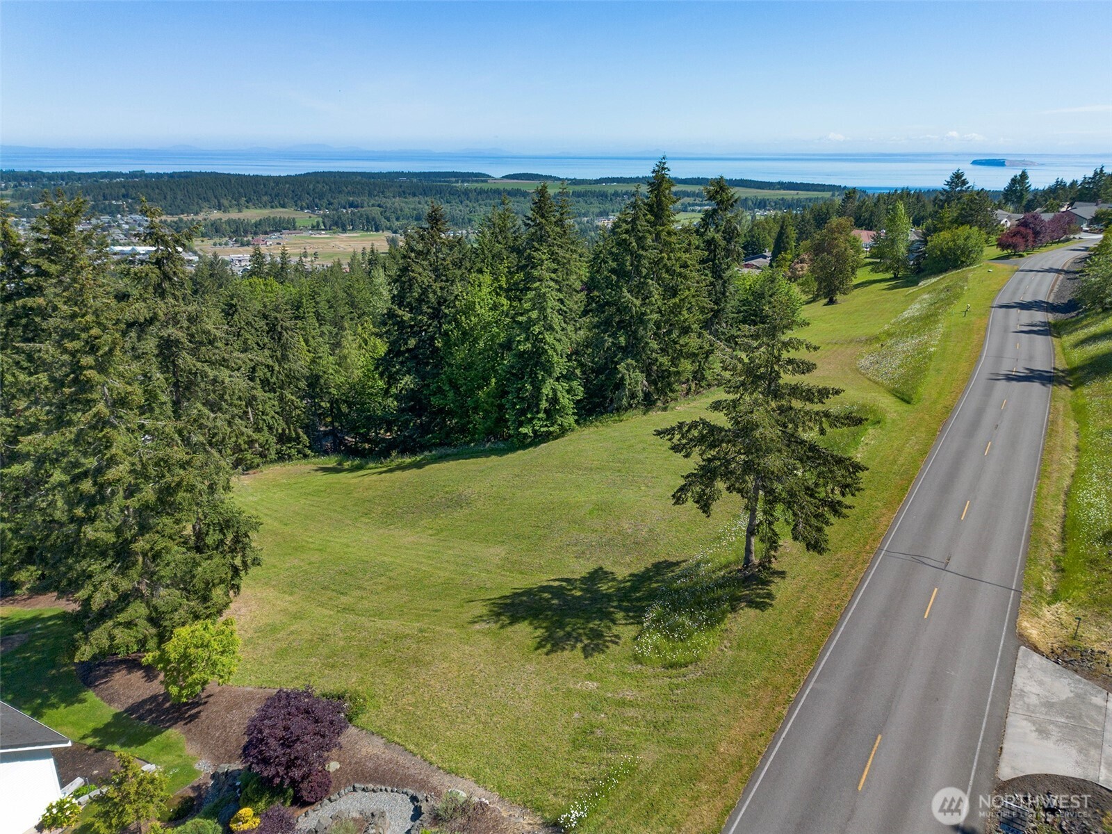 1 Owls Nest Road Sequim, WA 98382 - Photo 2 of 31 a view of a lake with a yard