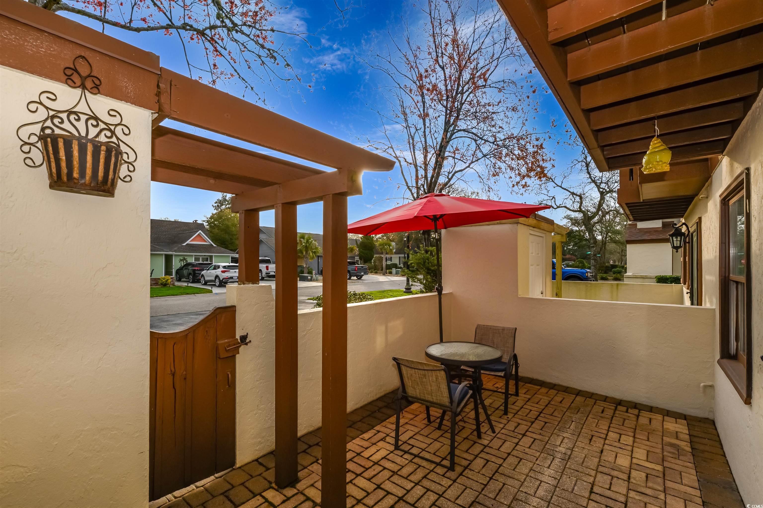 415 Queens Road, Unit B Myrtle Beach, SC 29572 - Photo 21 of 40 View of patio / terrace with a gate