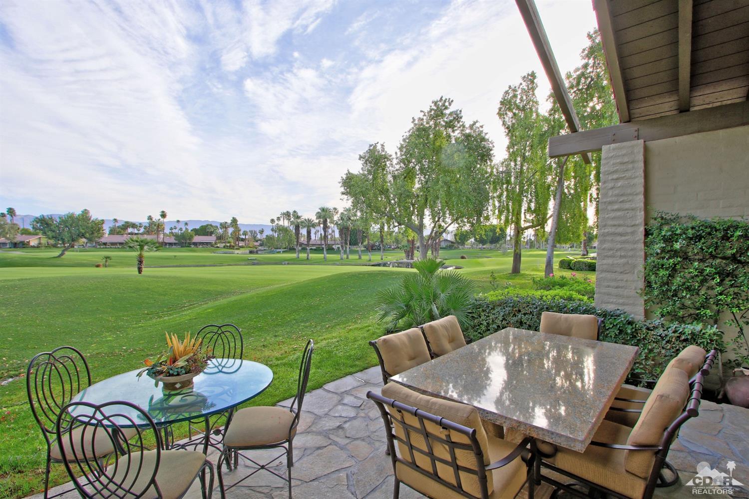 326 Red River Road Palm Desert, CA 92211 - Photo 2 of 54 a view of a table and chairs in the garden