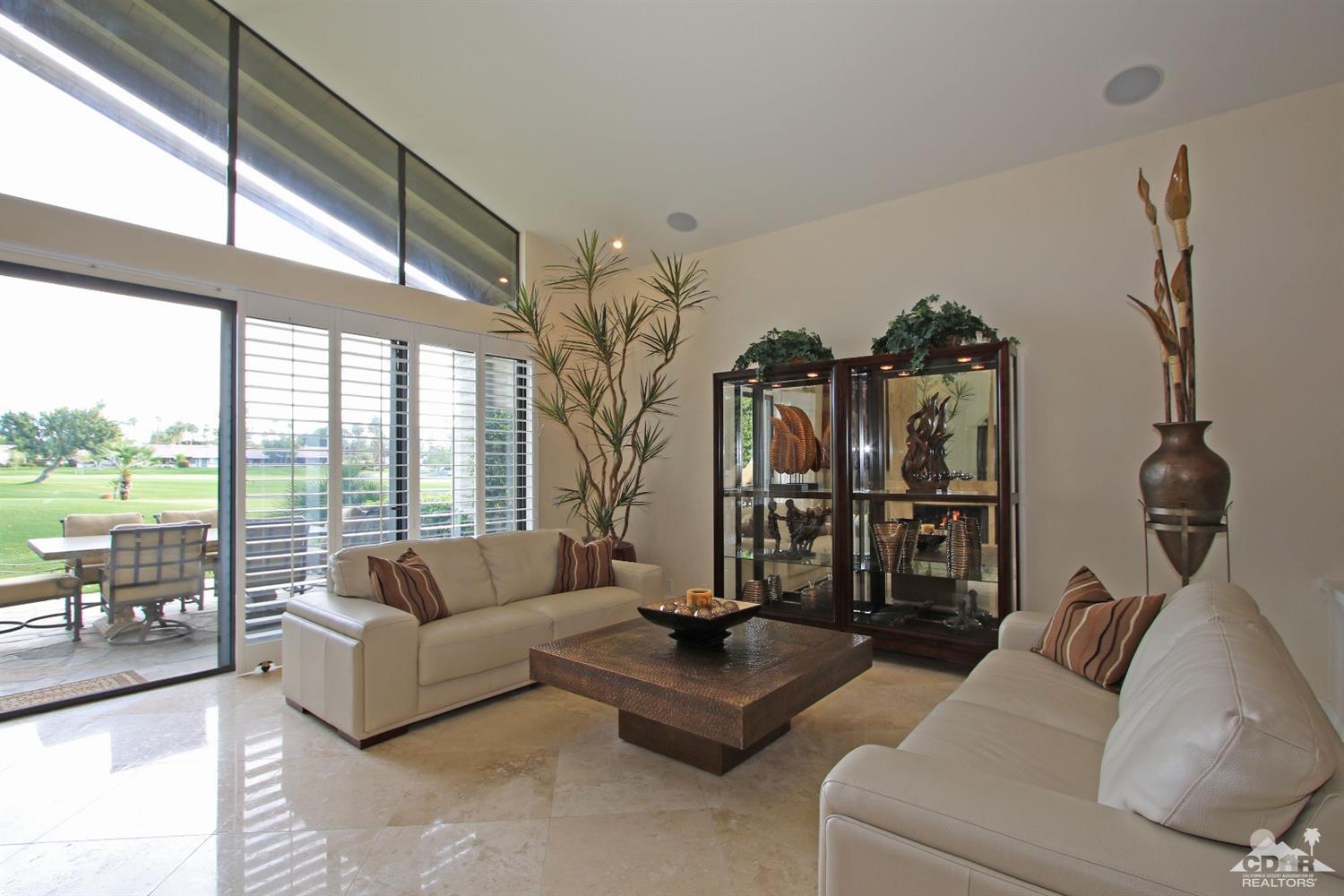 326 Red River Road Palm Desert, CA 92211 - Photo 11 of 54 a living room with furniture and a large window
