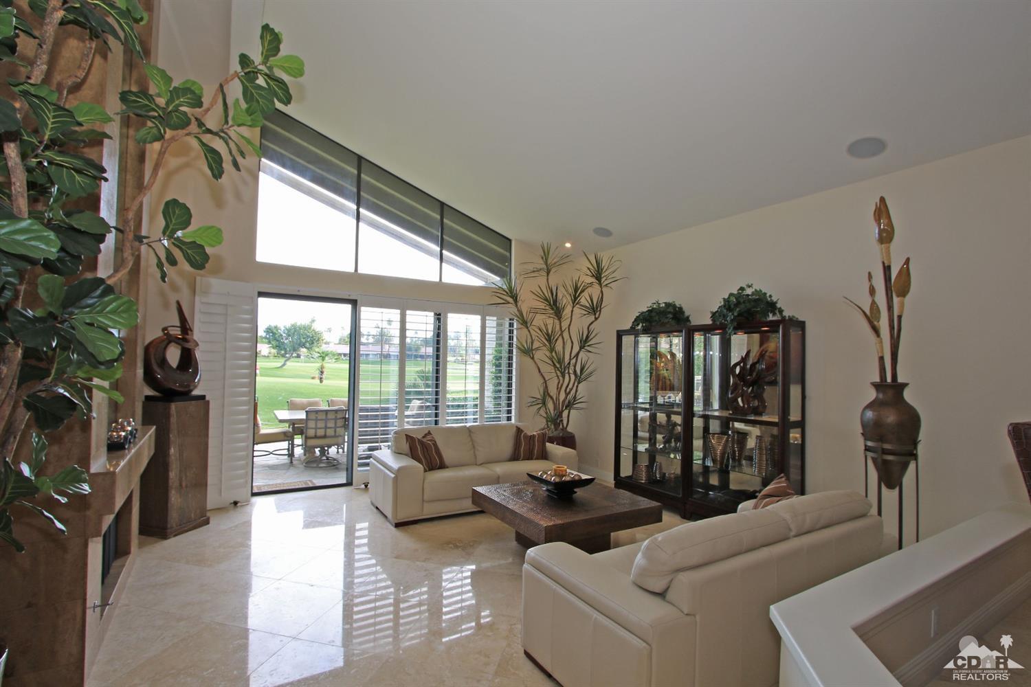 326 Red River Road Palm Desert, CA 92211 - Photo 13 of 54 a living room with furniture and a large window