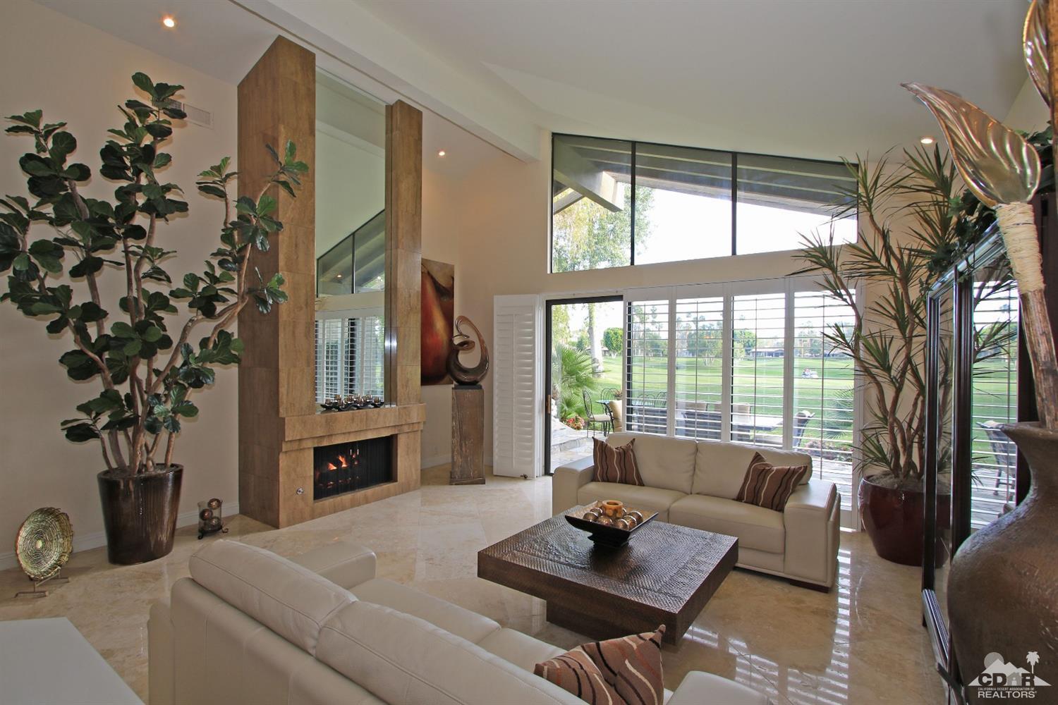 326 Red River Road Palm Desert, CA 92211 - Photo 14 of 54 a living room with furniture and a large window
