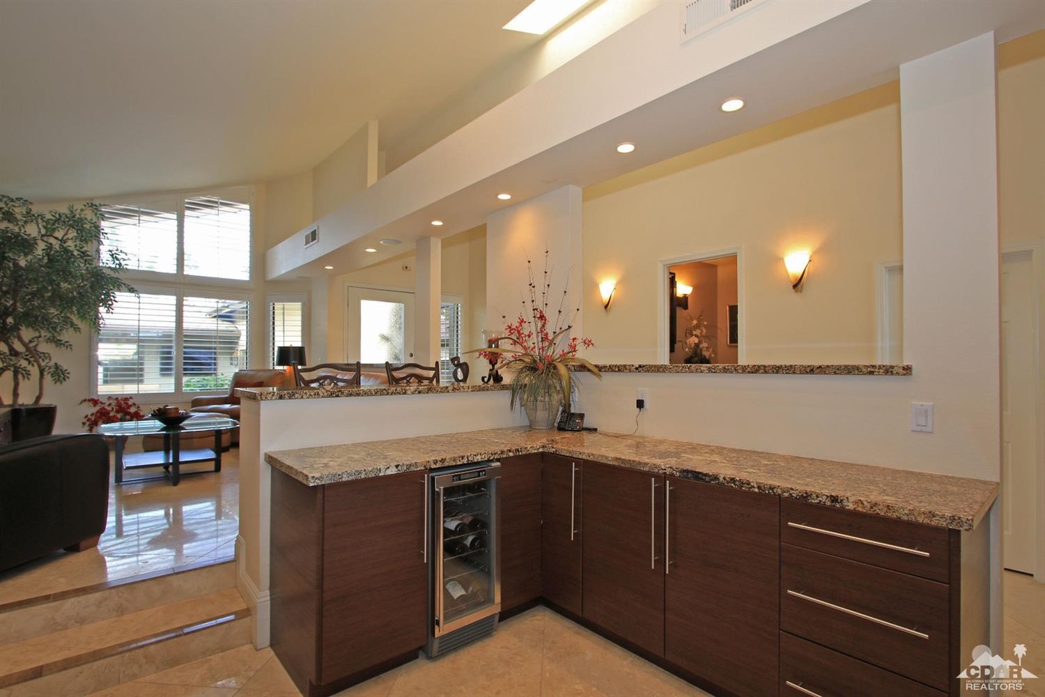 326 Red River Road Palm Desert, CA 92211 - Photo 18 of 54 a kitchen with stainless steel appliances granite countertop a sink and cabinets