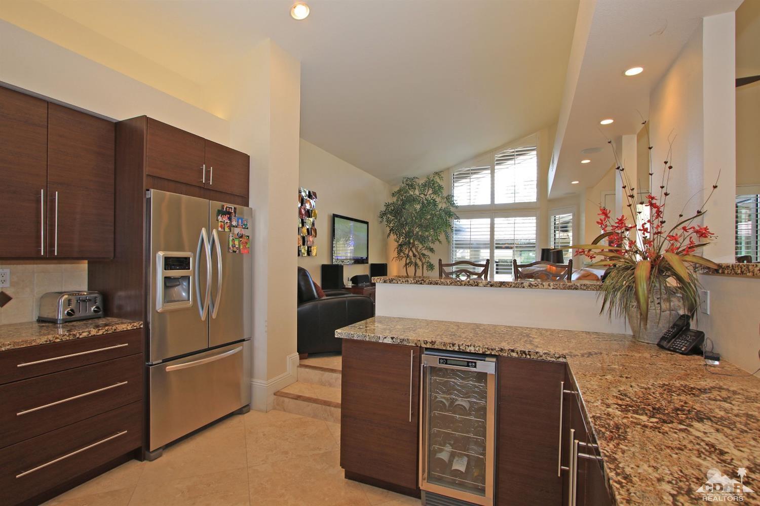 326 Red River Road Palm Desert, CA 92211 - Photo 19 of 54 a view of a kitchen with stainless steel appliances granite countertop a refrigerator and a stove