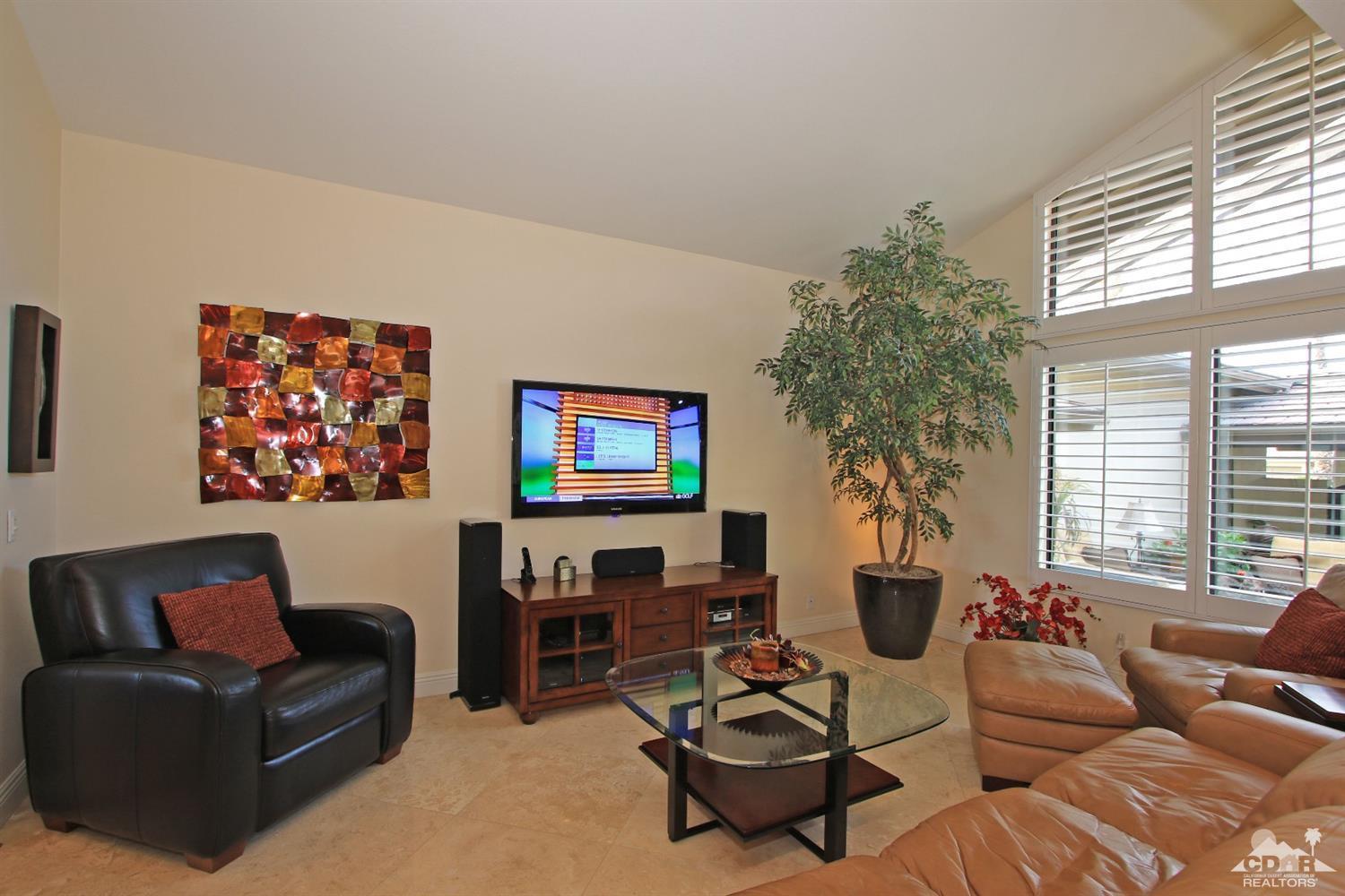 326 Red River Road Palm Desert, CA 92211 - Photo 22 of 54 a living room with furniture a flat screen tv and a large window