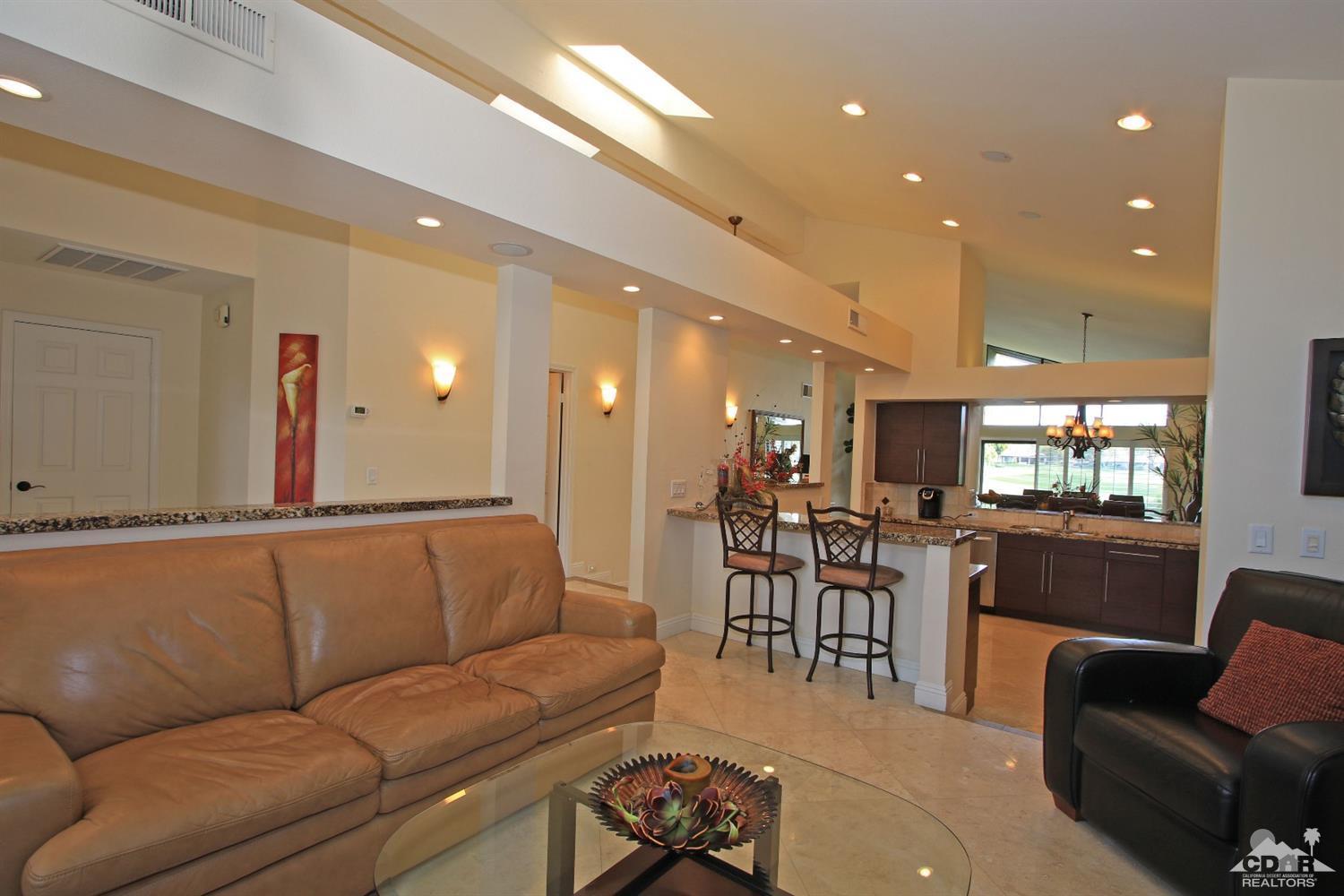 326 Red River Road Palm Desert, CA 92211 - Photo 23 of 54 a living room with furniture kitchen view and a large window