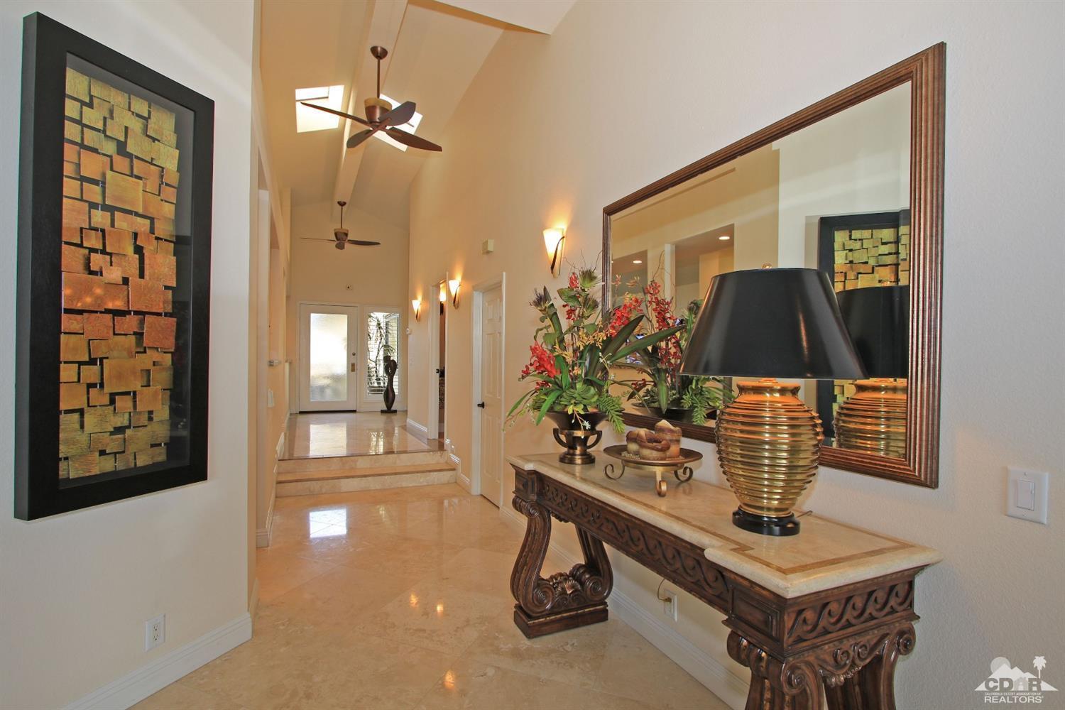 326 Red River Road Palm Desert, CA 92211 - Photo 29 of 54 a front view of a house with garden