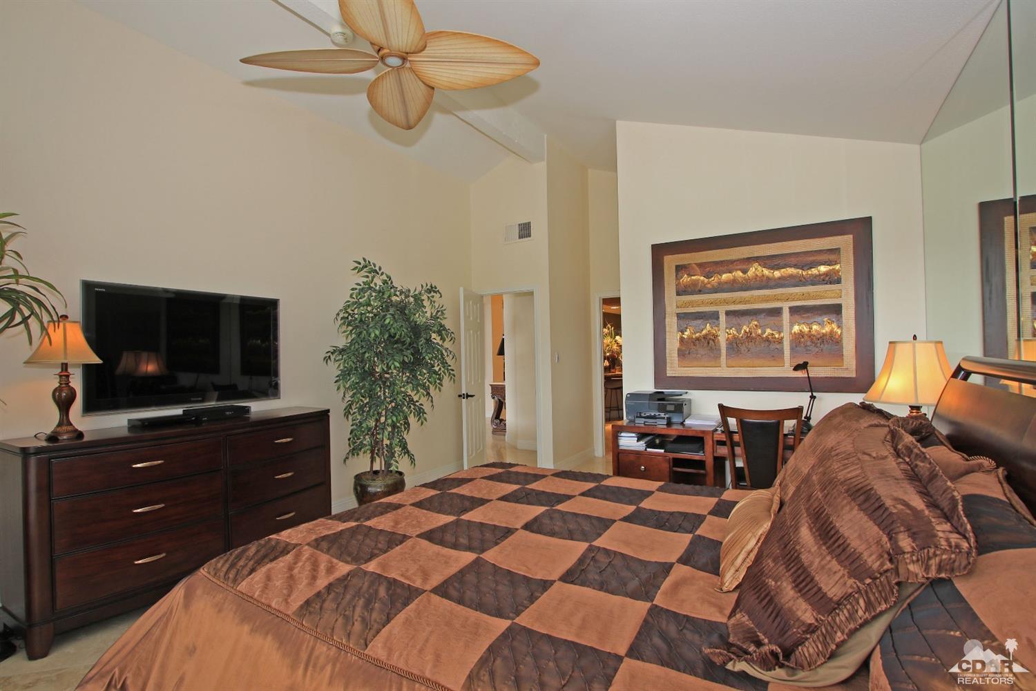 326 Red River Road Palm Desert, CA 92211 - Photo 35 of 54 a bedroom with a bed and a flat screen tv
