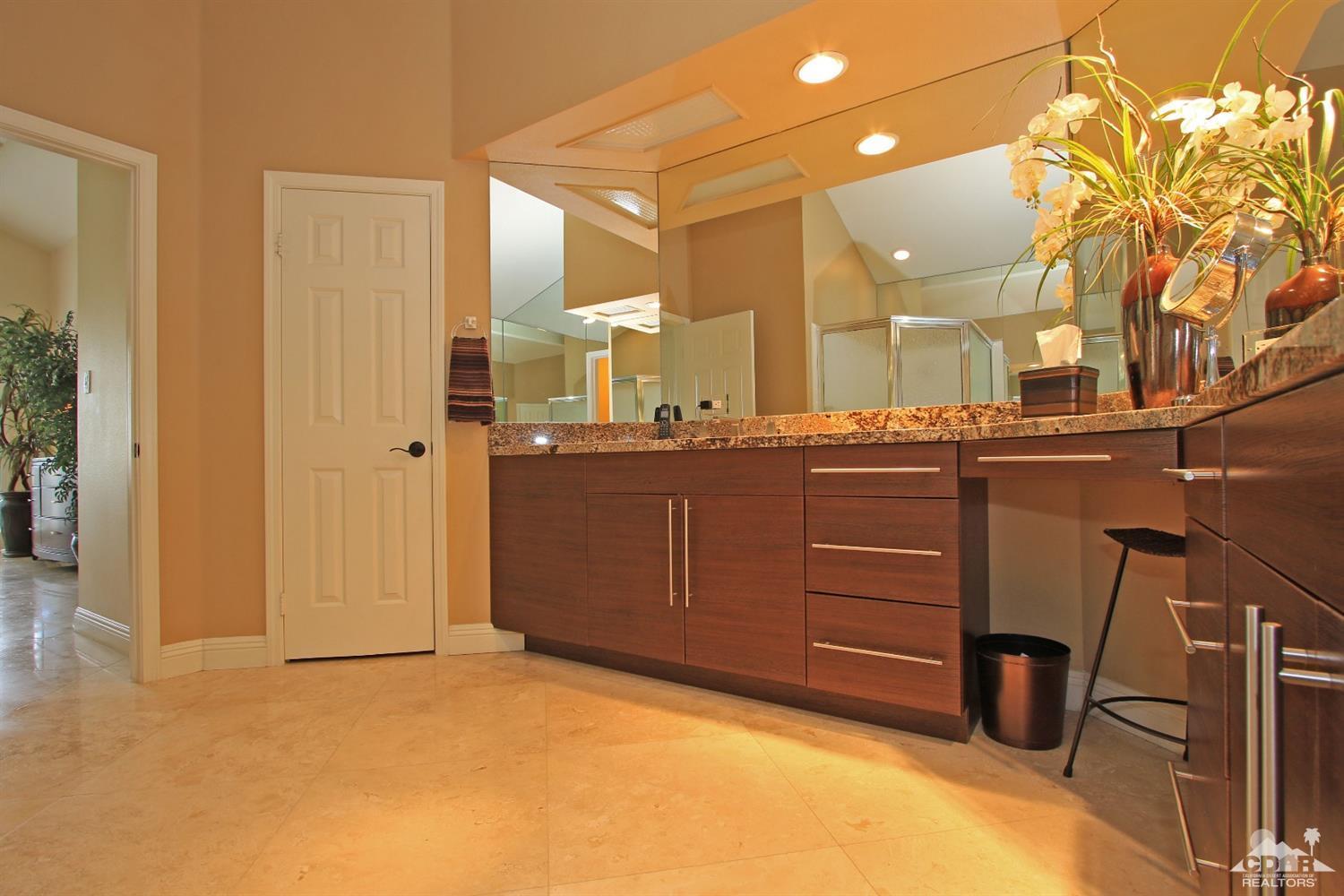 326 Red River Road Palm Desert, CA 92211 - Photo 38 of 54 a bathroom with a sink and a mirror