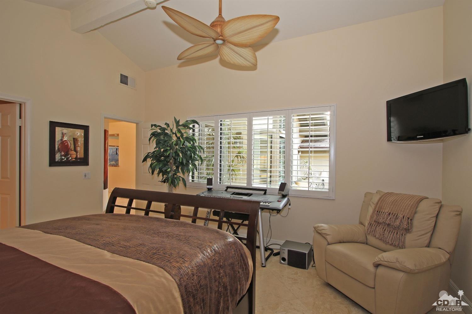 326 Red River Road Palm Desert, CA 92211 - Photo 40 of 54 a bed room with a bed and a television