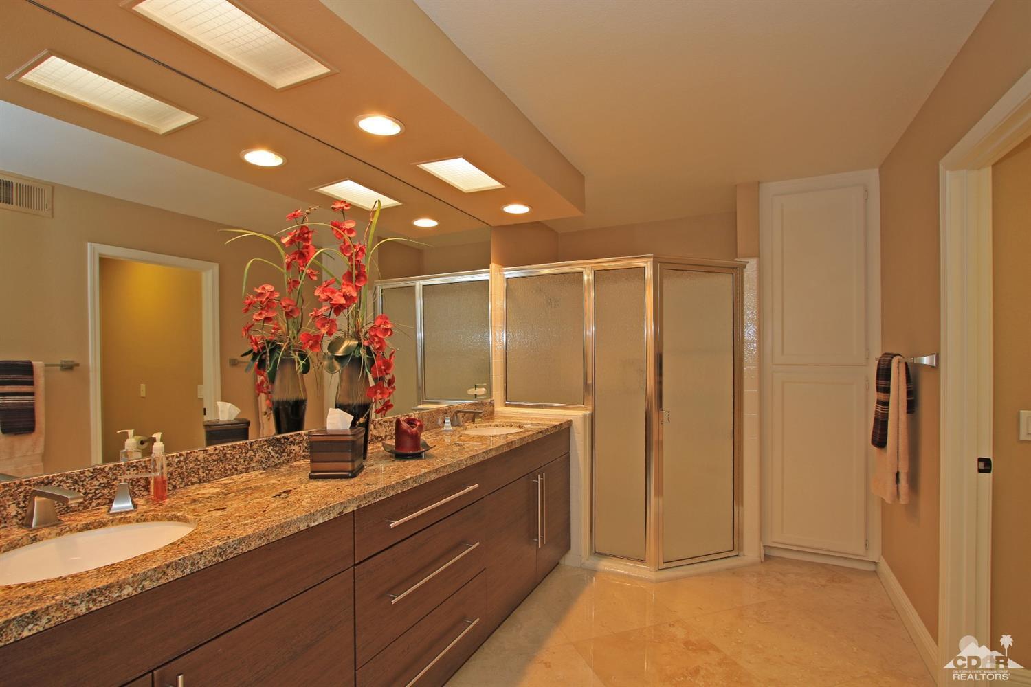 326 Red River Road Palm Desert, CA 92211 - Photo 41 of 54 a spacious bathroom with sinks mirror and shower