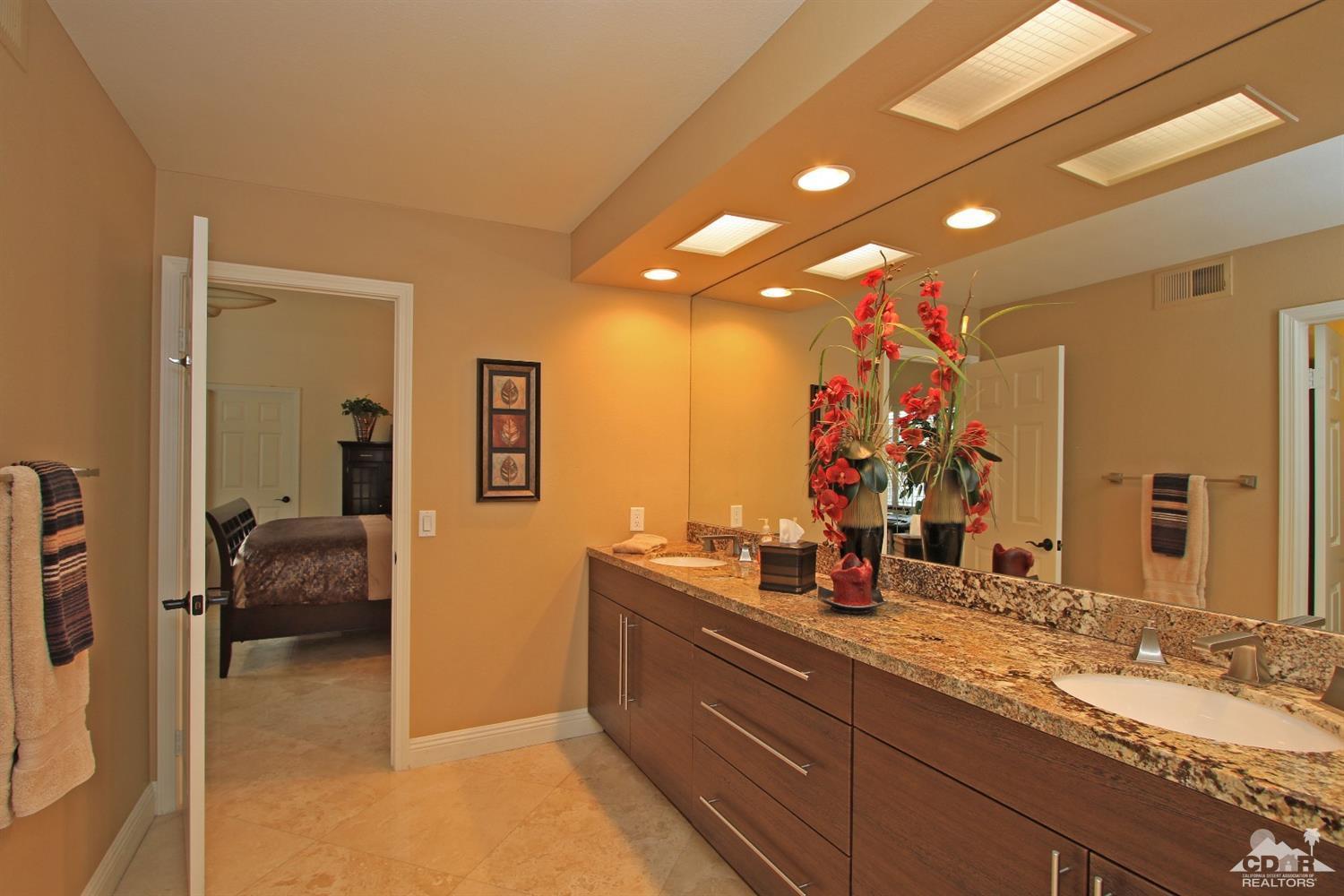 326 Red River Road Palm Desert, CA 92211 - Photo 42 of 54 a bathroom with a double vanity sink and a mirror