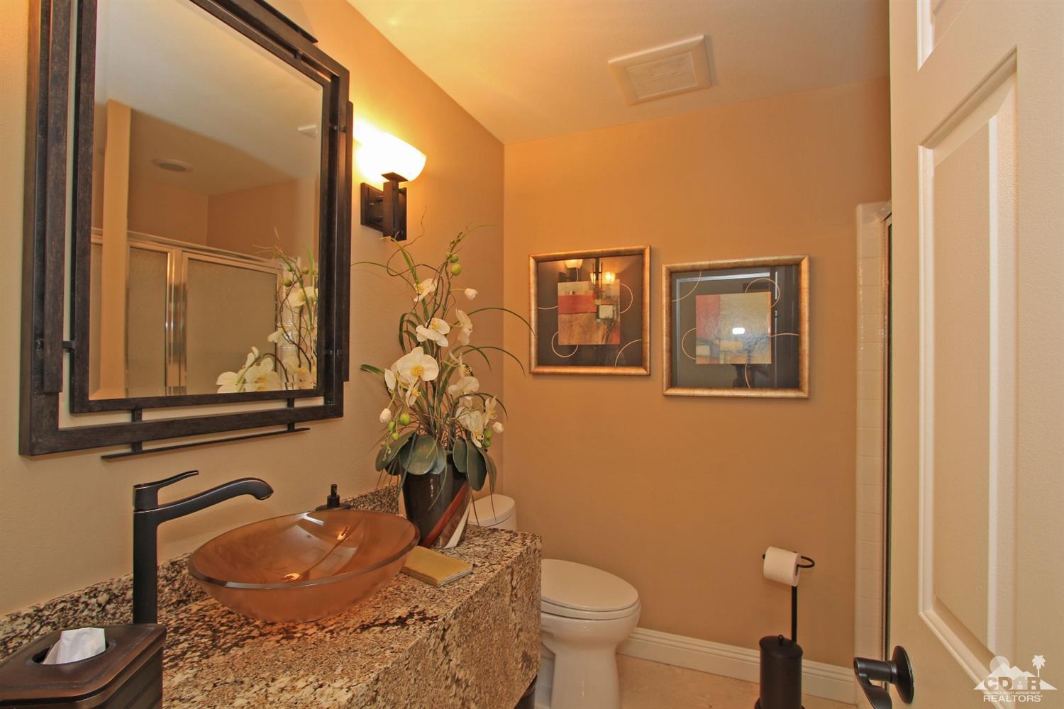 326 Red River Road Palm Desert, CA 92211 - Photo 43 of 54 a bathroom with a toilet sink and mirror