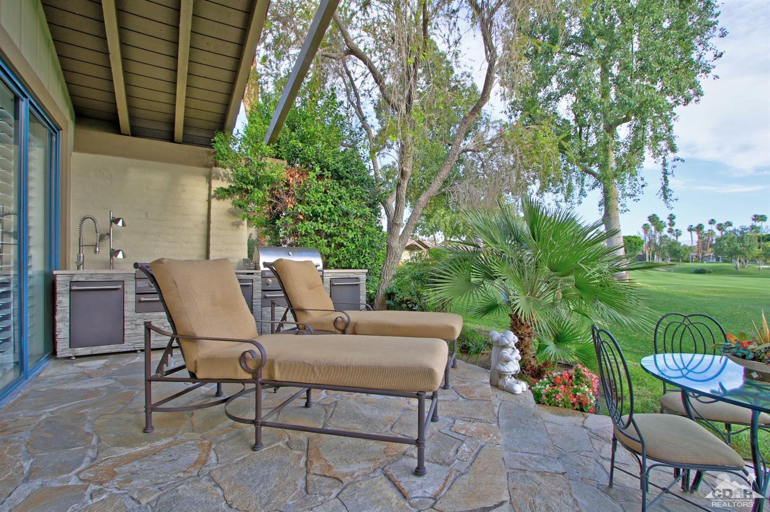 326 Red River Road Palm Desert, CA 92211 - Photo 44 of 54 a view of a chairs and table in the patio