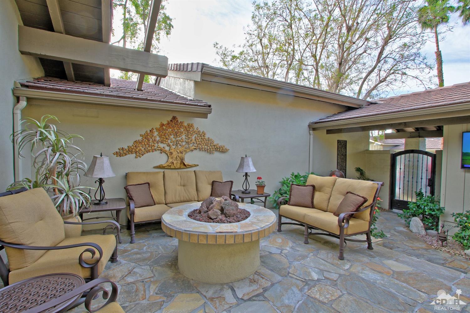 326 Red River Road Palm Desert, CA 92211 - Photo 6 of 54 a view of a patio with couches and potted plants