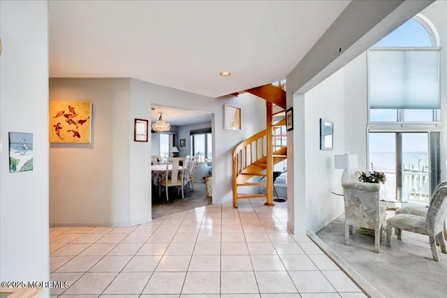 a view of a hallway with seating area
