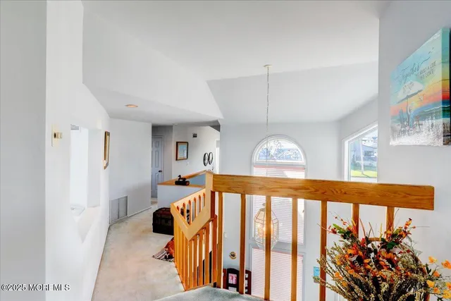 a view of a swimming pool with an outdoor seating and a tv
