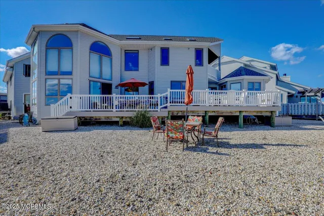 an aerial view of a house with a ocean view