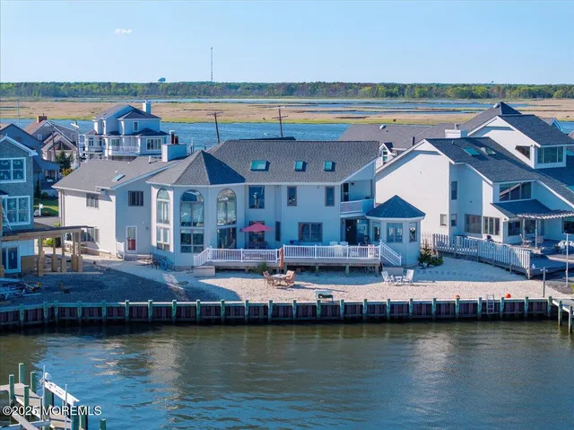 an aerial view of a house with a lake view