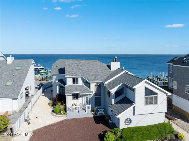 a front view of a house with a yard and a garage
