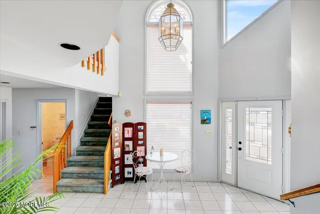 a living room with furniture fireplace and windows