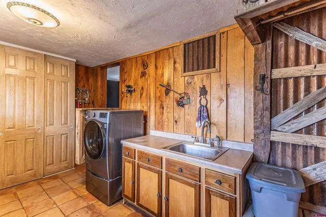 a kitchen that has a sink and a stove