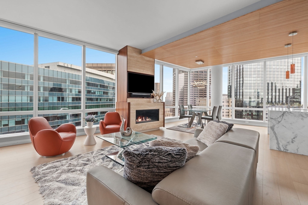 a living room with fireplace furniture and a flat screen tv