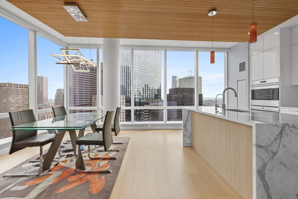 1 Franklin Street, Unit 3808 Boston, MA 02110 - Photo 12 of 40 a view of a workspace with furniture and a window