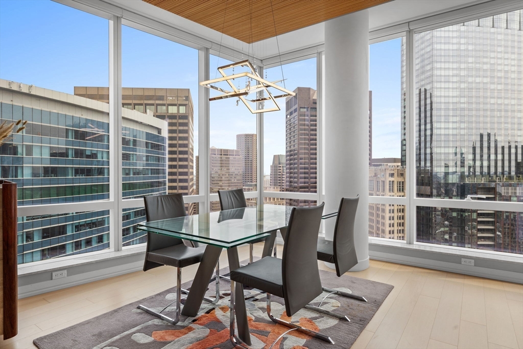 1 Franklin Street, Unit 3808 Boston, MA 02110 - Photo 13 of 40 a view of a dining room with furniture and window