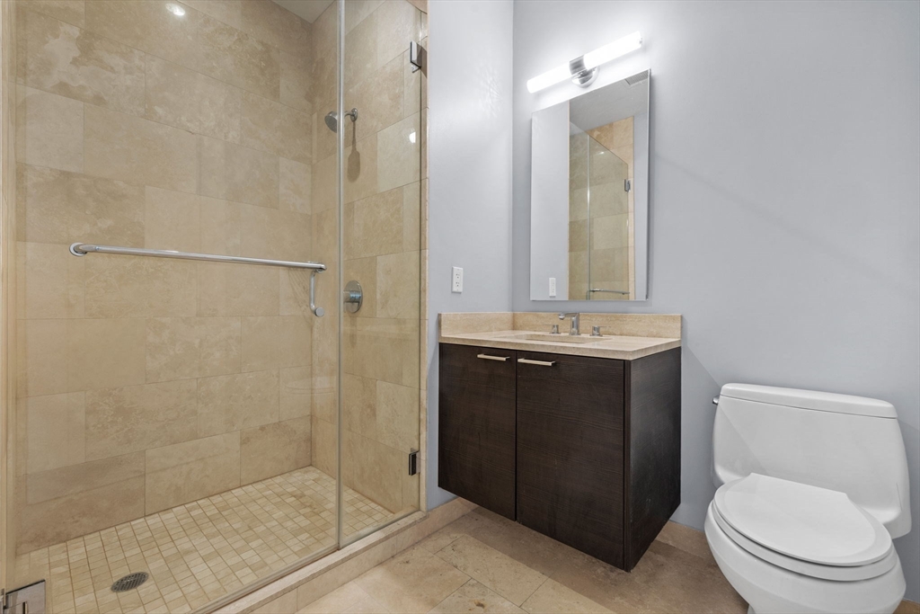 1 Franklin Street, Unit 3808 Boston, MA 02110 - Photo 22 of 40 a bathroom with a sink a toilet and shower