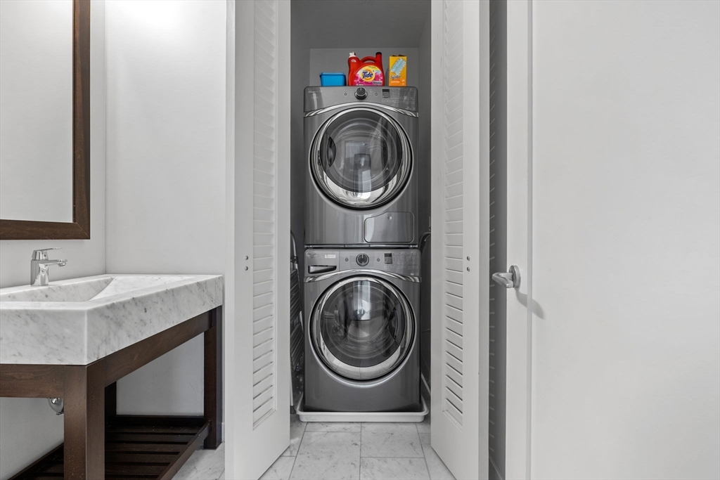 1 Franklin Street, Unit 3808 Boston, MA 02110 - Photo 24 of 40 a utility room with sink dryer and washer
