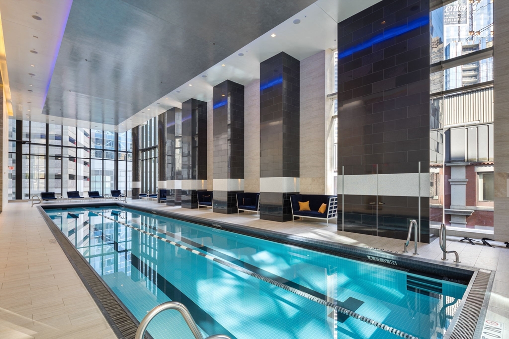 1 Franklin Street, Unit 3808 Boston, MA 02110 - Photo 29 of 40 a view of swimming pool with outdoor seating