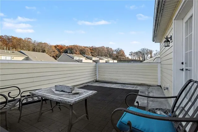 a view of a balcony with chairs