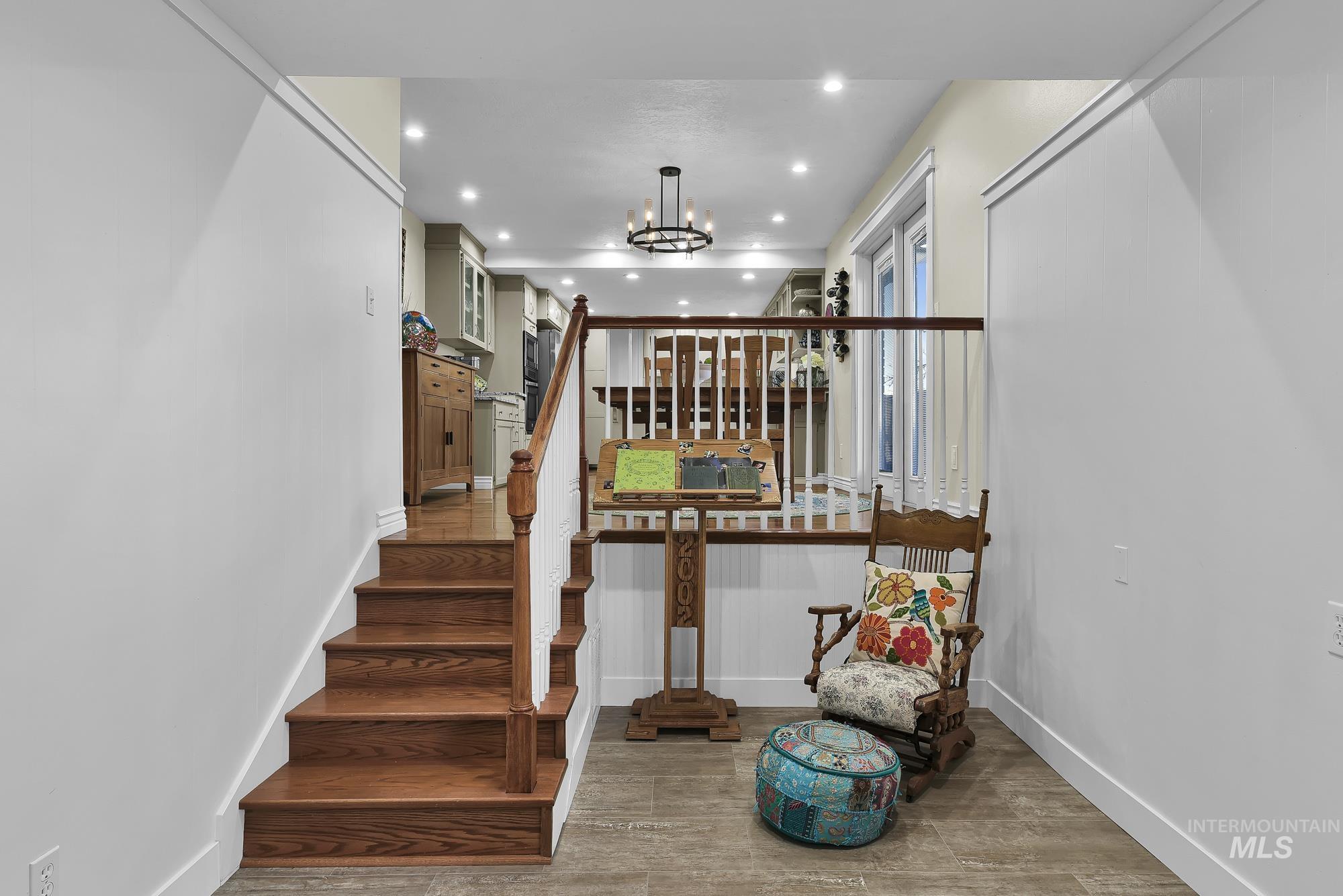 315 East Pat Lane Caldwell, ID 83607 - Photo 18 of 50 Stairway to Family Room area featuring a cozy sitting area and recessed lighting