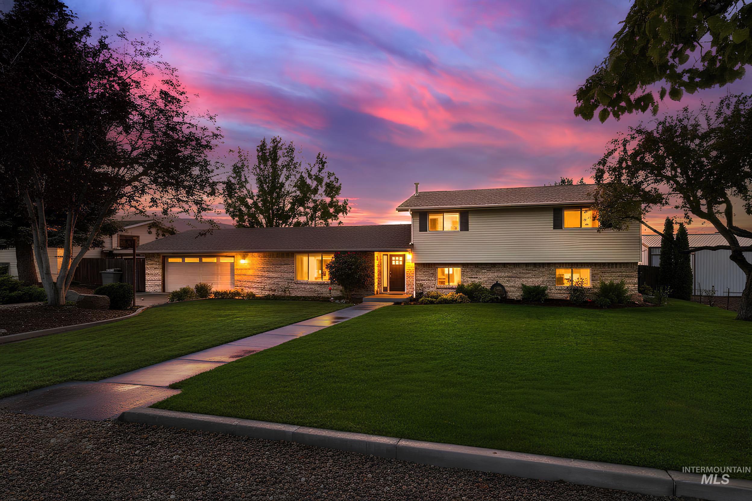 315 East Pat Lane Caldwell, ID 83607 - Photo 2 of 50 Tri-level home with brick accent and vinyl siding