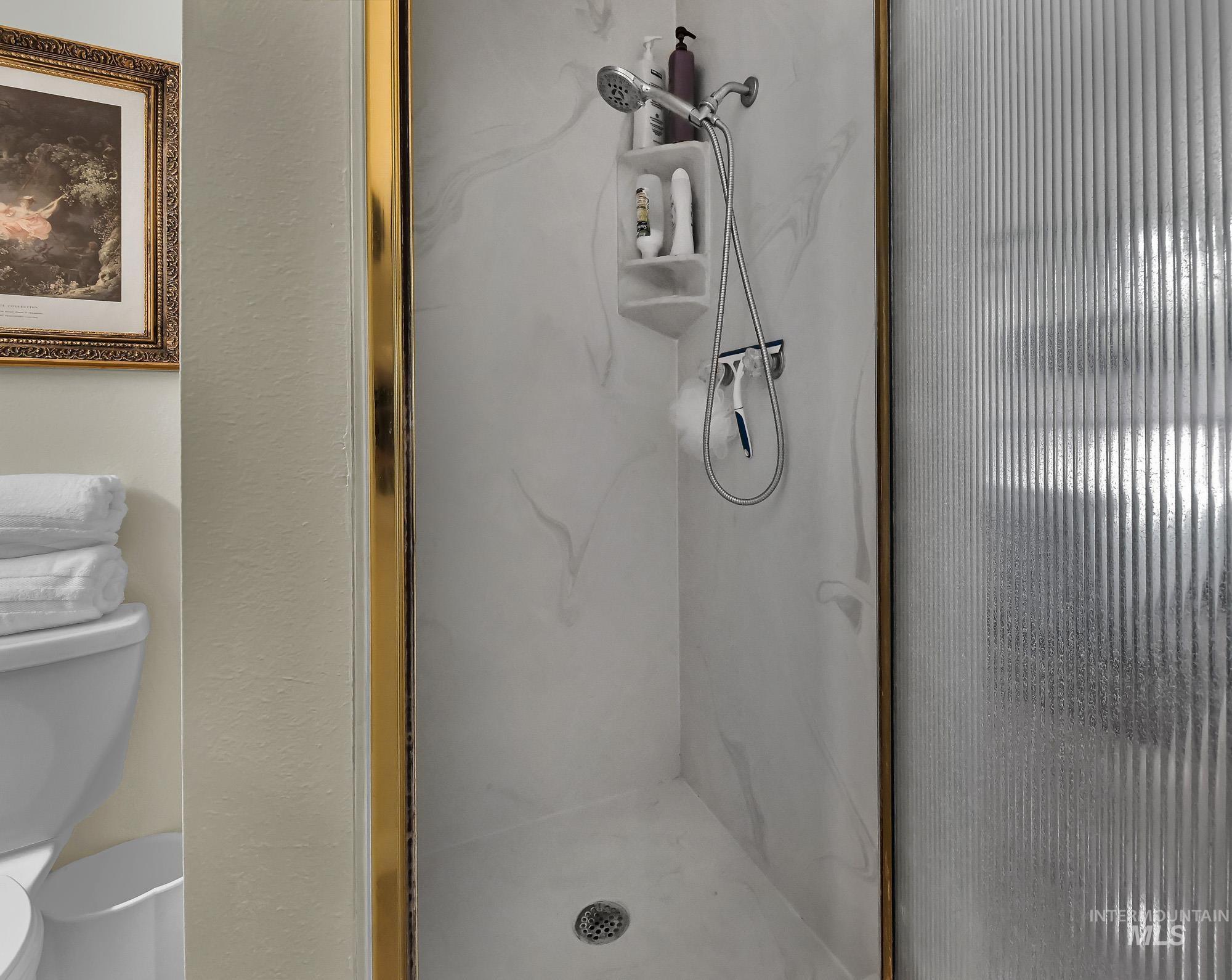 315 East Pat Lane Caldwell, ID 83607 - Photo 37 of 50 Primary Bathroom featuring a marble shower