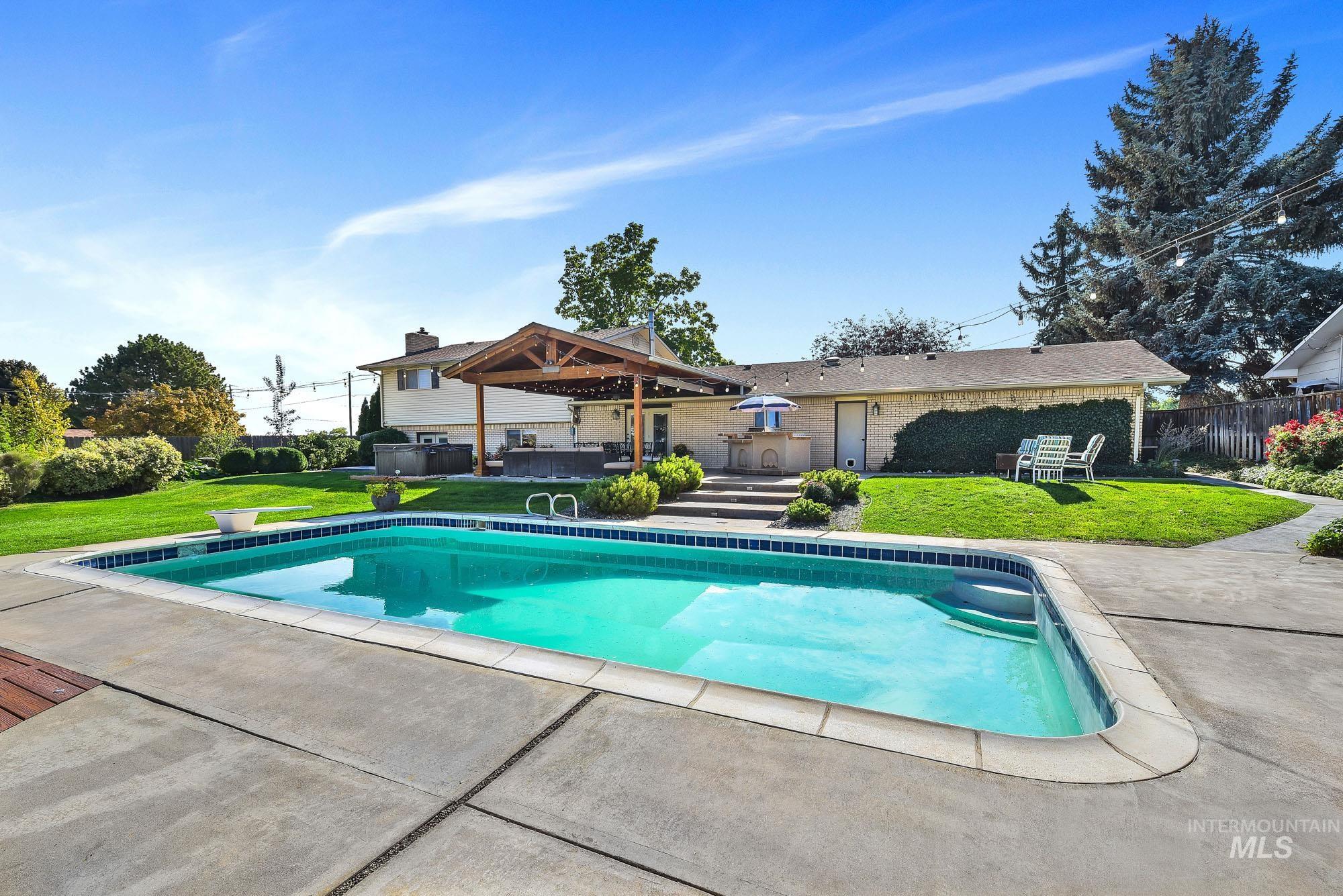 315 East Pat Lane Caldwell, ID 83607 - Photo 44 of 50 View of pool with covered patio and outdoor lounge area - house with amazing surroundings