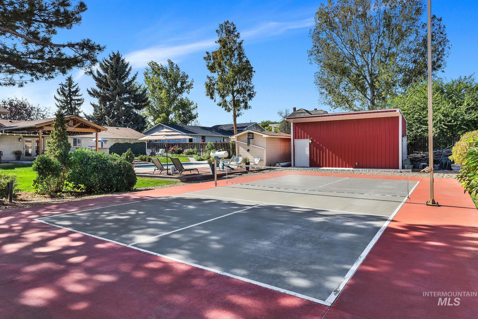 315 East Pat Lane Caldwell, ID 83607 - Photo 47 of 50 View of private pickle ball court featuring a lighted court and the side of the shop