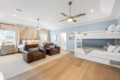 a view of a dining room with furniture and a potted plant