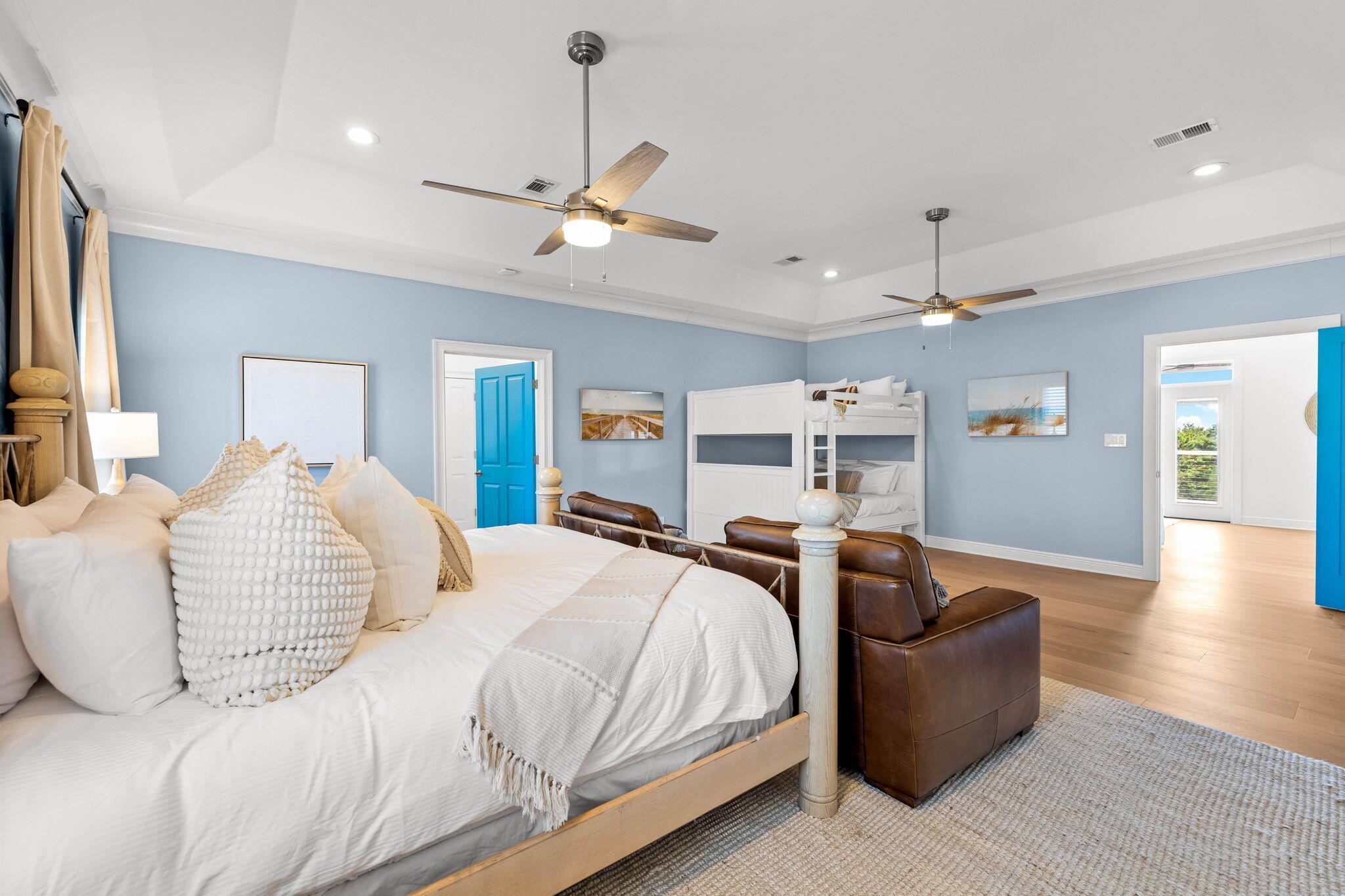 204 Sandstone Street Santa Rosa Beach, FL 32459 - Photo 22 of 80 a bedroom with a large bed and a chandelier