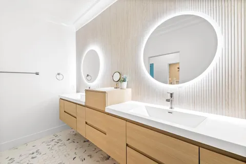 a bedroom with a bed tv and a window