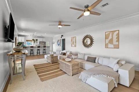 a bed sitting in a spacious bedroom next to a window