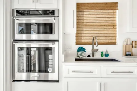 a view of an entryway with wooden floor and front door