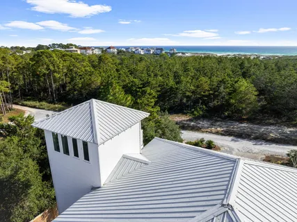 a kitchen with a refrigerator stove and white cabinets