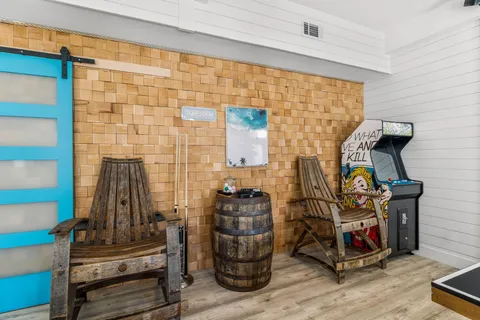 a bedroom with a large bed and a flat tv screen on dresser