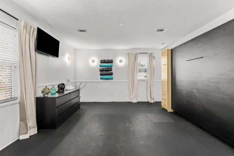 a bathroom with a sink a mirror and a shower